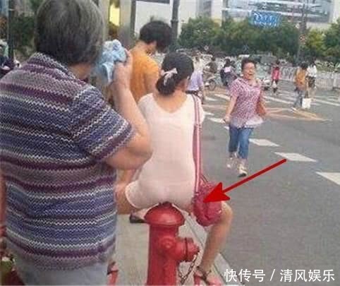 搞笑GIF圖：妹子妳當街整理自己的短裙，看錯的人還以為妳要幹什麼！
